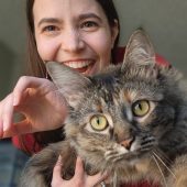 N.K. Valek laughing behind Ryka while Ryka crawls off N.K.'s arms toward the camera, as if the camera is prey and Ryka is God.